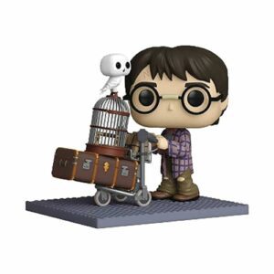 Figura Funko Pop! de Harry Potter empujando un carrito con una lechuza y maletas.