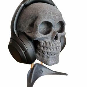 Soporte de auriculares en forma de calavera con diseño realista, marca Enhanc3d Designs.