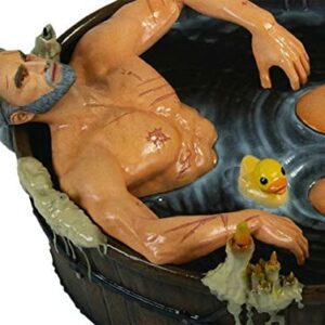 Figura de Geralt de Rivia en una bañera con patitos de goma.