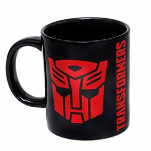 Taza negra de cerámica con el logotipo rojo de Transformers y texto en el lateral.