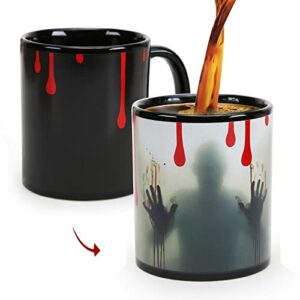 Taza mágica de cerámica con diseño de Zombie en color negro y gotas rojas de sangre.