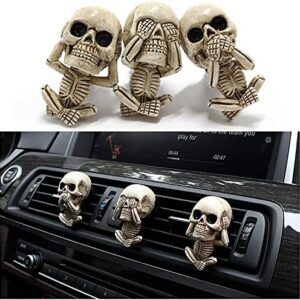 Ambientador de coche con figuras de calaveras en estilo "No ver, no oír, no hablar", marca Idefair.