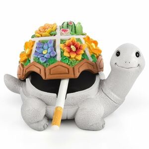 Cenicero en forma de tortuga con tapa decorada con flores de colores.
